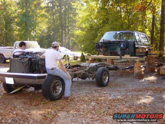 dsc00440.jpg Note the strap.  With the back tires aired down to about 6psi for clearance, we had used one of the F-250s in low range to creep the frame forward and clear.  At this point we'd been working for about five hours -- takes a while to do things this way when you're being cautious to keep all your limbs intact.