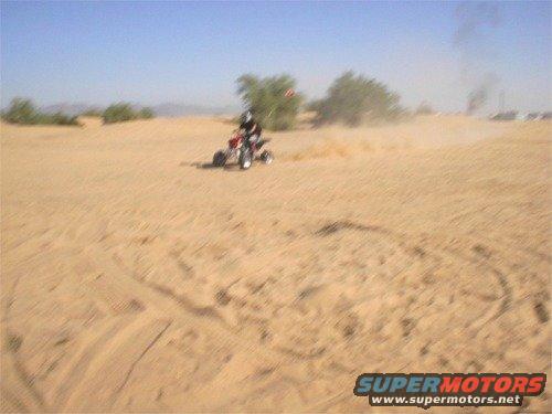 web-im001459.jpg Mike running around on the raptor around camp. 