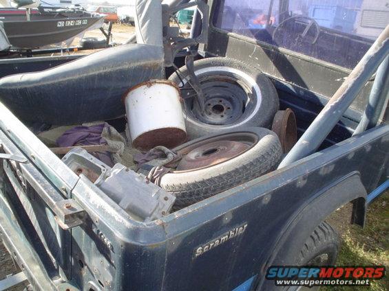 picture-046.jpg bed, BW tranny, 2 tires with rims seat and a metal bucket.