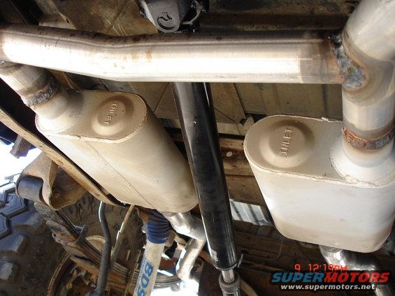 Underside of 1979 Ford Bronco showing dual exhaust mufflers and BDS shocks