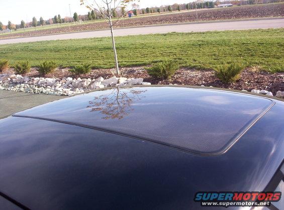 Carbon fiber sunroof on a dark car