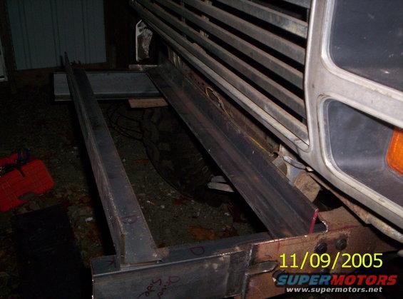 Custom steel winch bumper being fabricated and welded onto a vehicle frame. Date stamp reads 11/09/2005