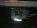 1992 Ford Crown Victoria - Car amplifier with visible wiring is shown in detail, resting on a dark carpeted surface.