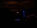 1992 Ford Crown Victoria - Aftermarket stereo installed in a car interior, illuminated with blue lights.