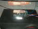1992 Ford Crown Victoria - Car audio equipment, including an amplifier and subwoofer, is installed in the trunk of a vehicle.