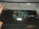 1992 Ford Crown Victoria - Car amplifier and wiring are visible in the trunk of a vehicle, connected to a subwoofer box.