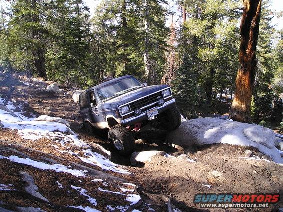 1986 Ford Bronco II navigating a rocky forest trail