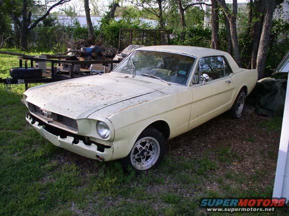 Yellow 1965 Ford Mustang coupe, front quarter view, weathered exterior