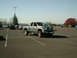 2002 Ford F-250 - A silver Dodge Ram 2500 pickup truck is parked in a lot on a sunny day.