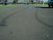 2002 Ford F-250 - Tire marks are visible on the asphalt, indicating recent vehicle activity.