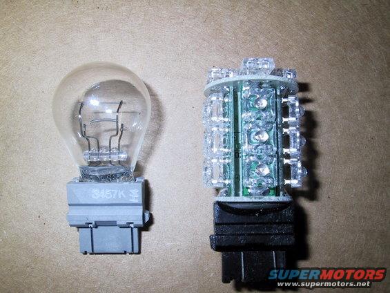 Old bulb next to new LED bulb. Bulb on left has '3457K' marking