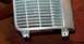 1985 Ford Crown Victoria LTD - This is a close-up view of a vehicle grille, showing its horizontal slat design and mounting points.