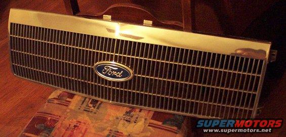 Ford oval badge on a chrome and dark grille