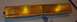 1985 Ford Crown Victoria LTD - An amber turn signal assembly is shown against a cardboard background.