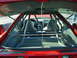 1994 Ford Probe - The interior of a 1994 Ford Probe features racing seats and a prominent roll cage, suggesting track use.