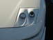 1994 Ford Probe - Close-up of the distinctive dual headlights on a white 1994 Ford Probe.