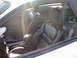 1994 Ford Probe - Interior of a 1994 Ford Probe, black leather seats and a view of the back.