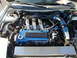 1994 Ford Probe - Engine bay of a Mazda vehicle, blue valve covers and custom intake.