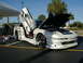 1994 Ford Probe - This customized 1994 Ford Probe features butterfly doors and an open hood revealing the engine bay.