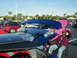 1994 Ford Probe - Several cars are parked with their hoods open, including a 1994 Ford Probe with a prominent blue spoiler.