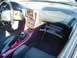 1994 Ford Probe - Interior view of a 1994 Ford Probe, a custom stereo and CD player in the glove box.