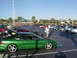 1994 Ford Probe - A green 1994 Ford Probe is displayed with its hood and trunk open at an outdoor car event.