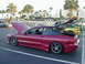 1994 Ford Probe - A maroon Ford Probe is parked with its hood and trunk open, alongside other cars.
