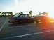 1994 Ford Probe - Two 1994 Ford Probes are parked in a lot, with the sun setting behind them.
