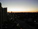 1994 Ford Probe - View of a city street and parking lot during twilight, with buildings silhouetted against the sky.