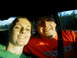 1994 Ford Probe - A couple smiles for a selfie while riding in a car.