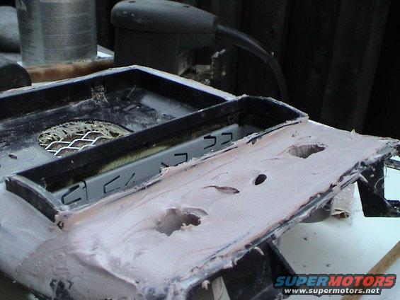 Center console modification in progress, showing body filler and cutouts