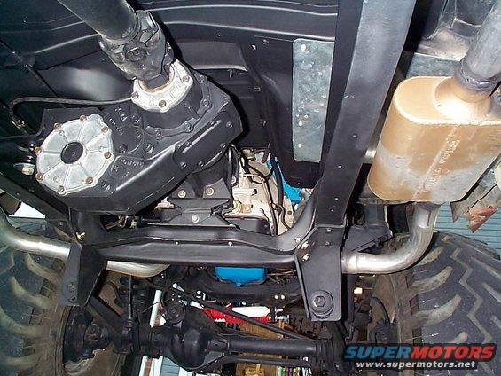 Underside of a 1979 Ford Bronco showing the transfer case, exhaust, and suspension components
