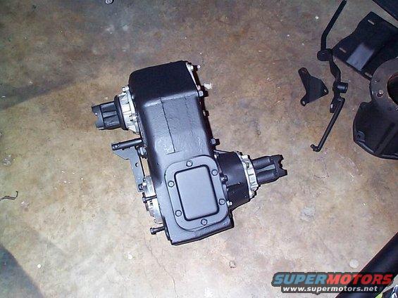 Black NP205 transfer case with silver accents on a concrete floor