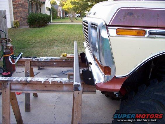 1979 Ford Bronco front clip with chrome grille and bumper, parked outside