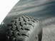1978 Ford Bronco - Close-up of a tire tread on asphalt. The image is from a vehicle enthusiast's registry album.