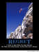 2001 Ford Crown Victoria - A snowboarder takes a leap off a steep, snow-covered mountain face against a clear blue sky.