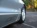 1994 Ford Probe - Close-up of a silver car's side panel, showing the GT emblem and wheel.