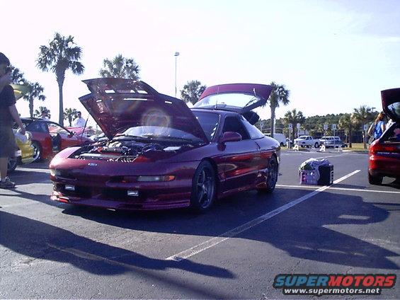 1995 Ford Probe, purple, front 3/4 view, hood and trunk open