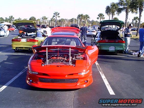 Red 1995 Ford Probe with hood open, front view
