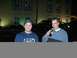 1996 Ford Probe - Two men are standing in front of a building at night, with cars parked behind them.