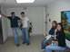1996 Ford Probe - Four people are in a hallway, two standing and two sitting, with a painting on the wall.