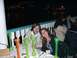 1996 Ford Probe - A group of people are seated at a table outdoors at night, with several tall, colorful glasses on the table.