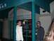 1996 Ford Probe - Two men are seen standing outside a bar, with a Budweiser sign illuminated inside.