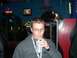 1996 Ford Probe - A man sips a drink in a dimly lit establishment with neon signs and a television in the background.