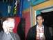1996 Ford Probe - Two men are in a bar, one taking a photo while the other holds a drink.