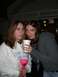 1996 Ford Probe - Two women are sharing a large drink from a white cup with straws, holding a pink novelty cup.
