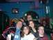 1996 Ford Probe - A group of friends gather for a photo in a brightly lit establishment.