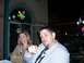 1996 Ford Probe - A couple enjoys a night out at a venue with illuminated signage.