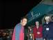 1996 Ford Probe - A group of people are seen socializing in front of a Daiquiri Bar entrance at night.