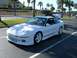 1996 Ford Probe - A white 1996 Ford Probe is parked in a lot with its trunk open, showing off its sporty design.